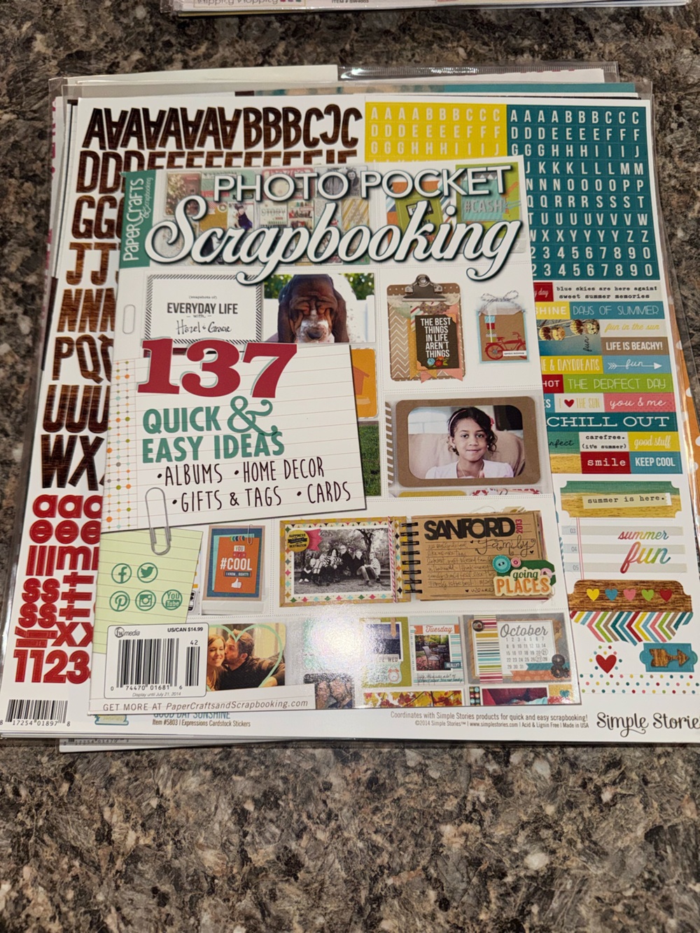 Scrapbook paper packs with stickers